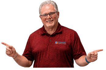 Jim Forker, owner of ZSmart Furniture, pointing to both sides